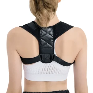 Back view of a woman wearing a black posture corrector over a white sports bra.
