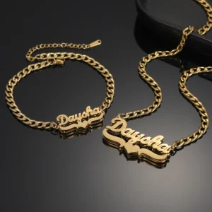 Gold chain necklace and bracelet with 'Dayak' name pendant.
