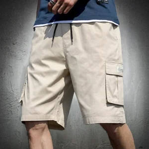 Beige cargo shorts with multiple pockets worn casually.