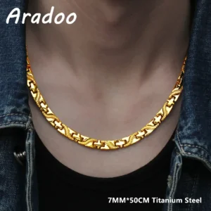 Gold-colored titanium necklace on a neck with denim jacket.
