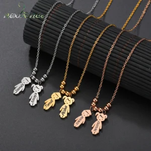 Bear-shaped name pendants on chain necklaces.