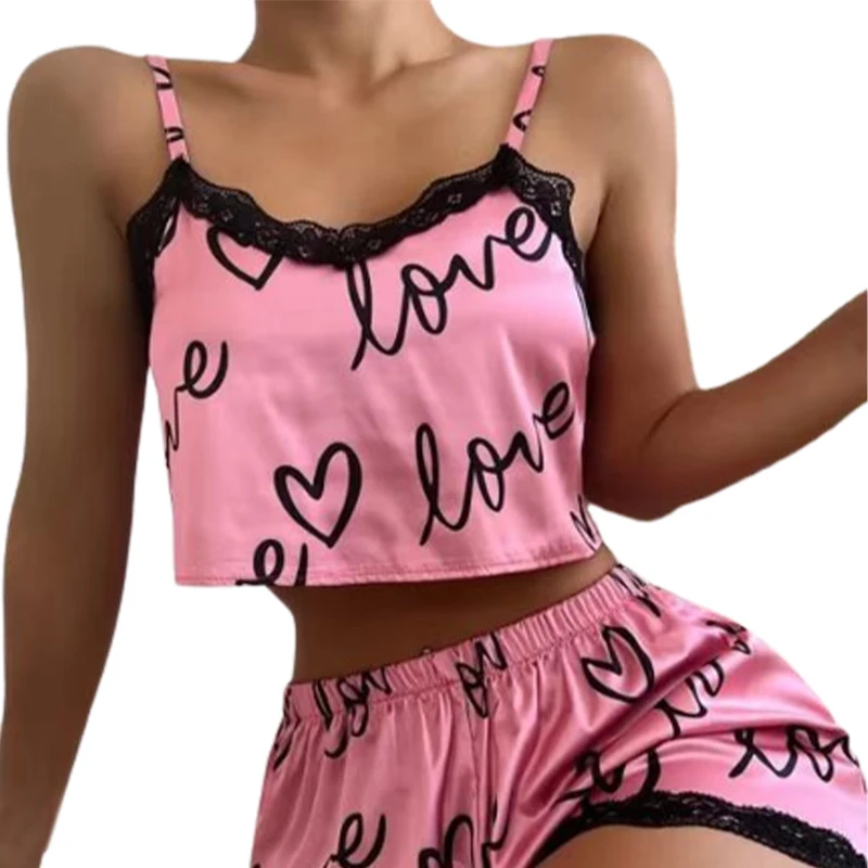 Pink pajama set with black love and heart prints.