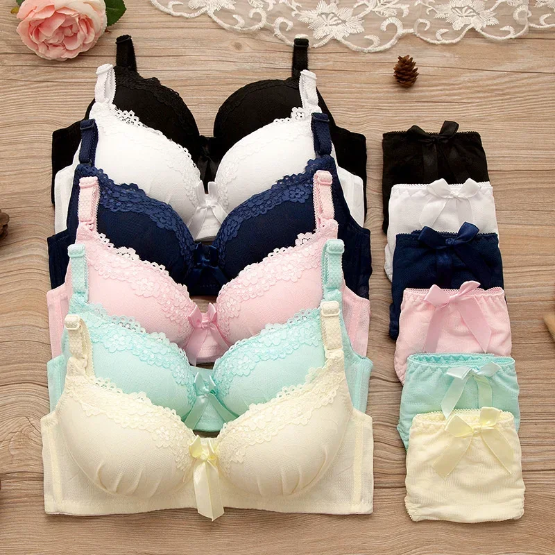Assorted pastel and dark-colored lace bras with matching panties.