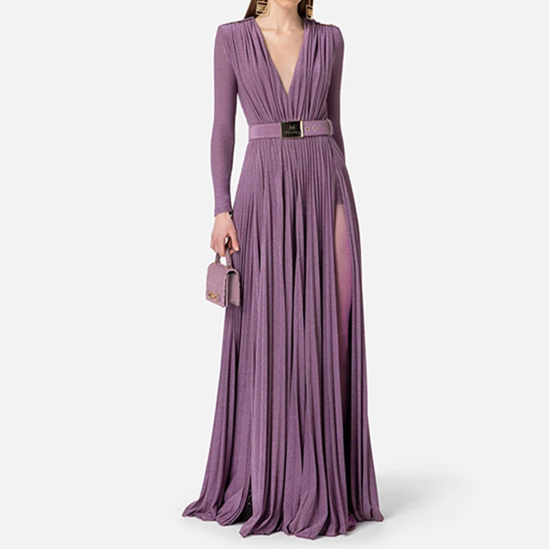 Elegant mauve pleated gown with long sleeves and a belted waist.