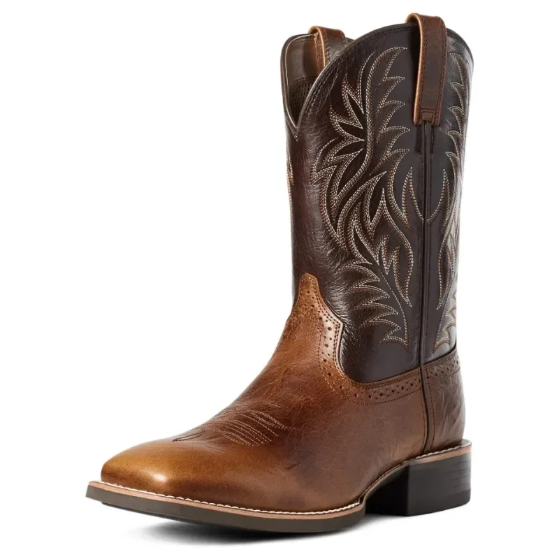 A stylish two-tone leather cowboy boot with intricate stitching.