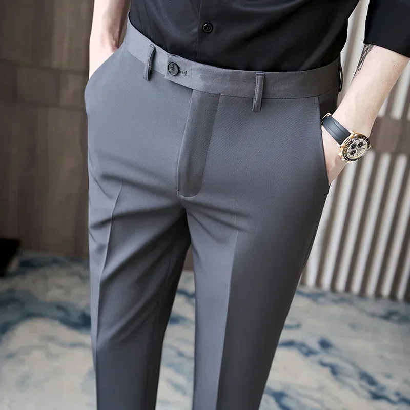 Man wearing gray pants and black shirt.