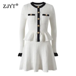 Elegant white knit dress with black trim and gold buttons.