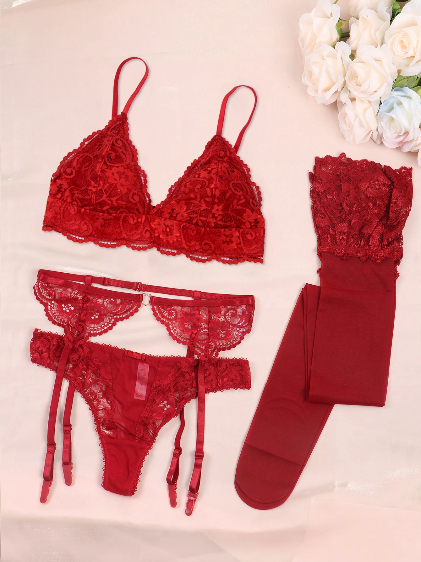 Red lace lingerie set with garter belt and stockings.