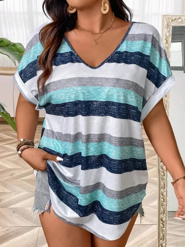 Woman wearing a casual striped V-neck shirt with blue and green hues.