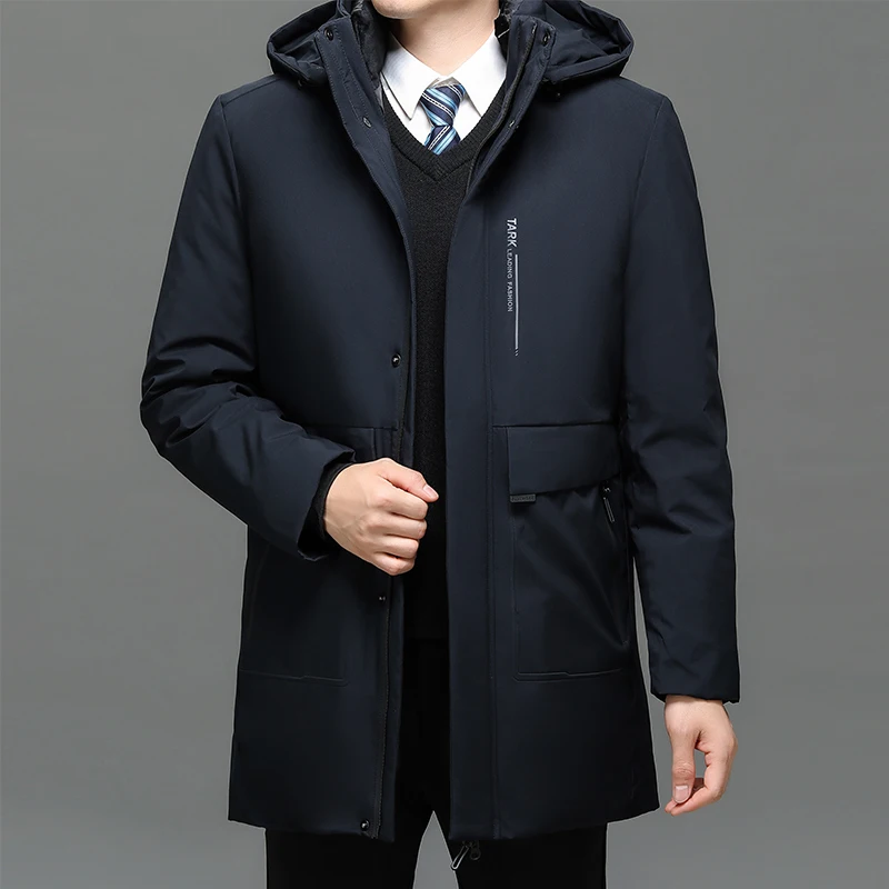 Man in formal winter coat and tie.