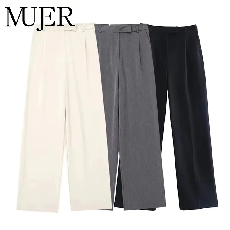 Three pairs of wide-leg pants in white, gray, and black.