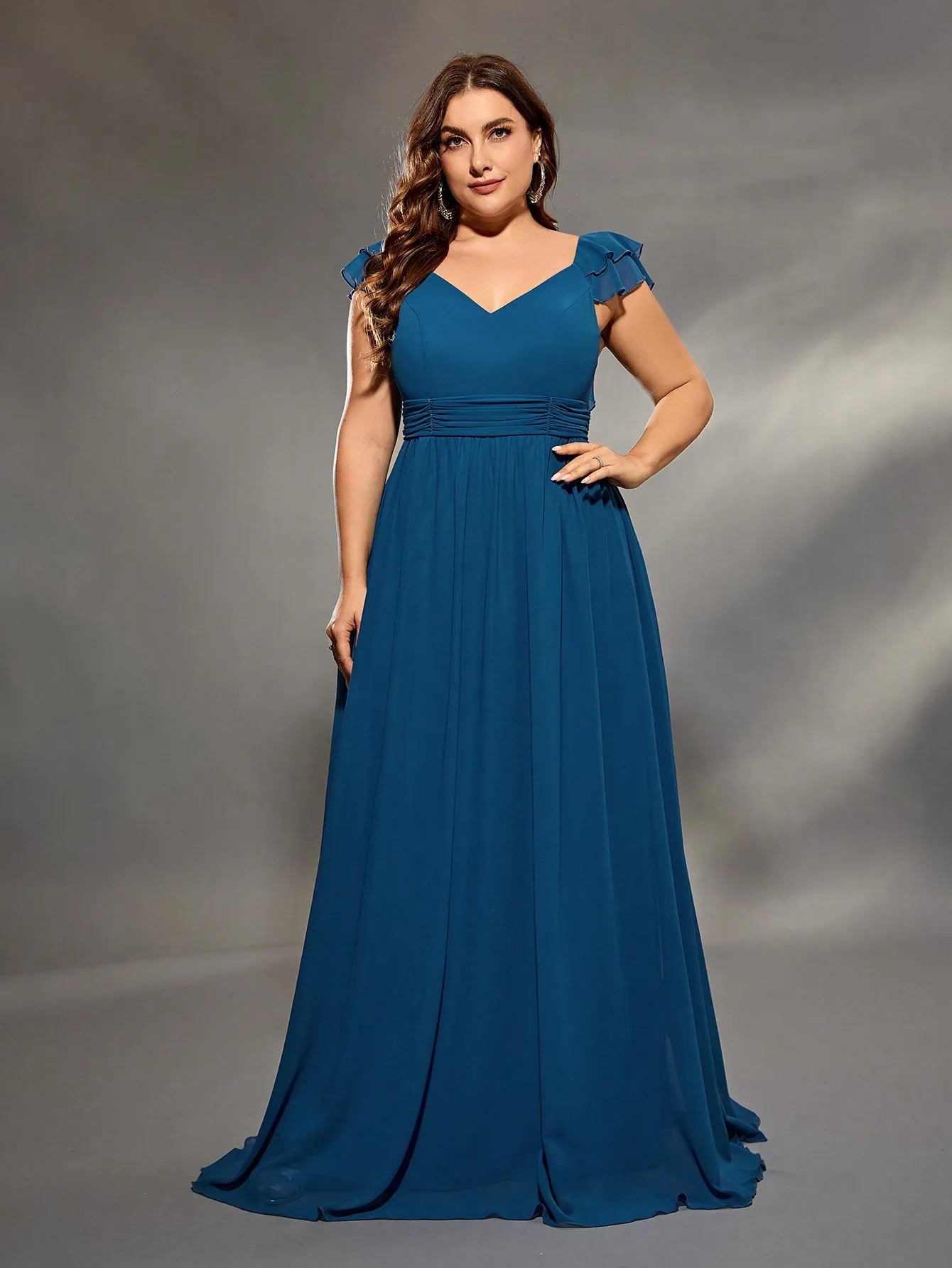 Elegant blue evening gown with lace sleeves and V-neckline.