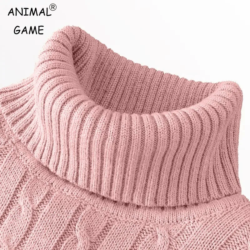 Pink knitted turtleneck sweater close-up.