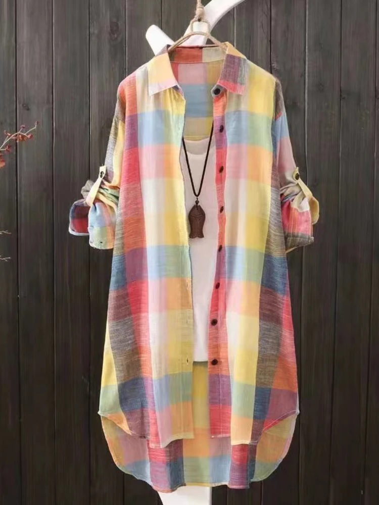 Colorful plaid long shirt dress with button front and pockets.