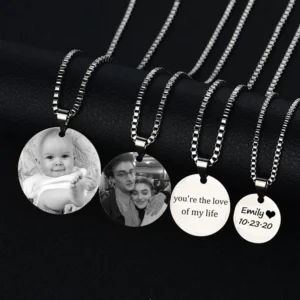Four personalized photo necklaces on display.