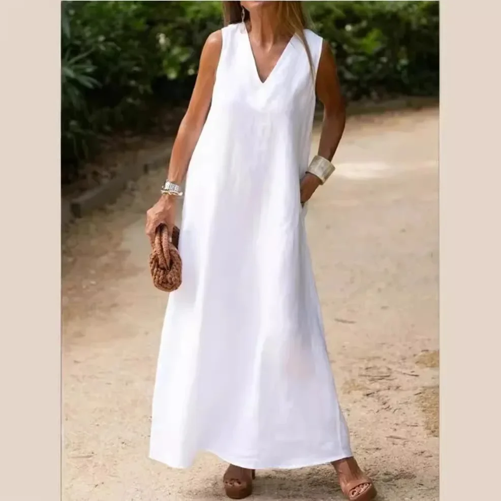 Elegant white sleeveless maxi dress with deep V-neck.
