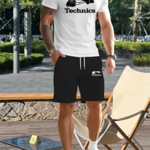 Man in casual outfit standing near chair.