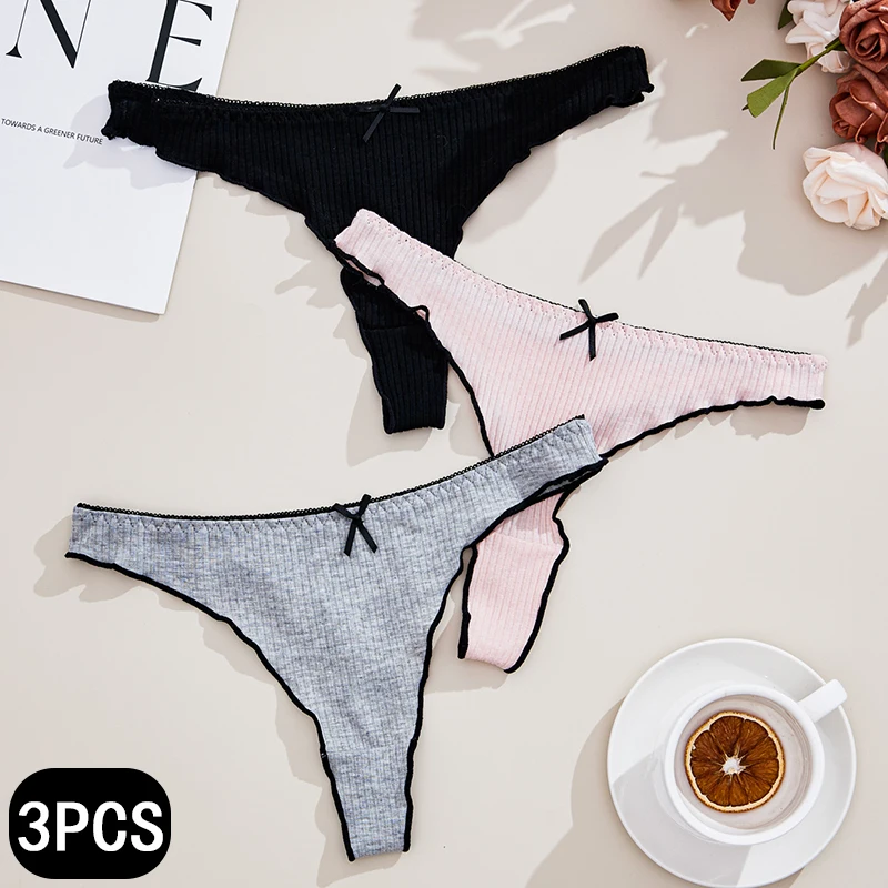 Set of three women's lace-trimmed thong panties in black, pink, and gray.