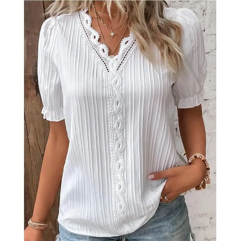 White ribbed blouse with lace-up neckline and short puff sleeves.