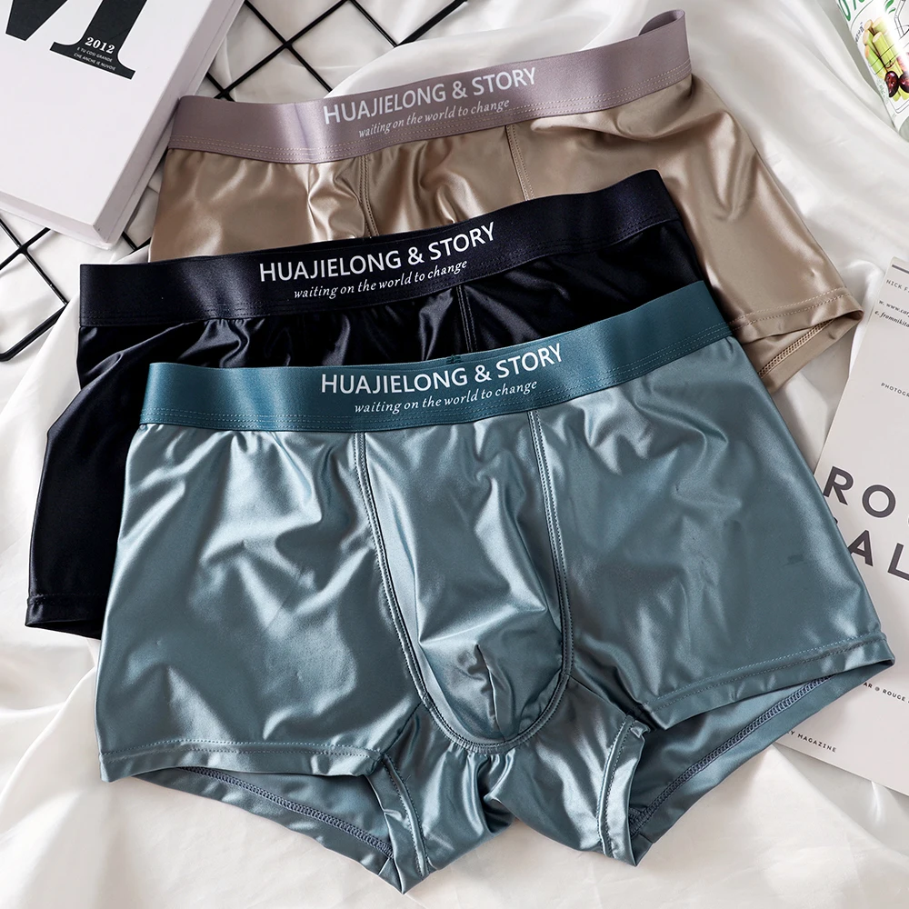 Three pairs of men's boxer briefs displayed.