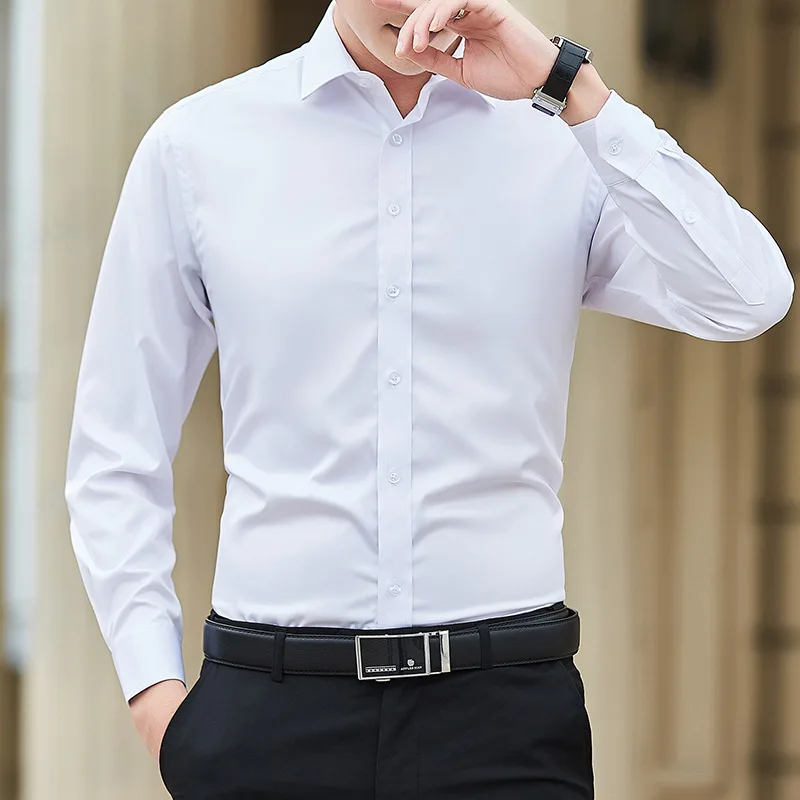 Man wearing a white dress shirt and black pants.